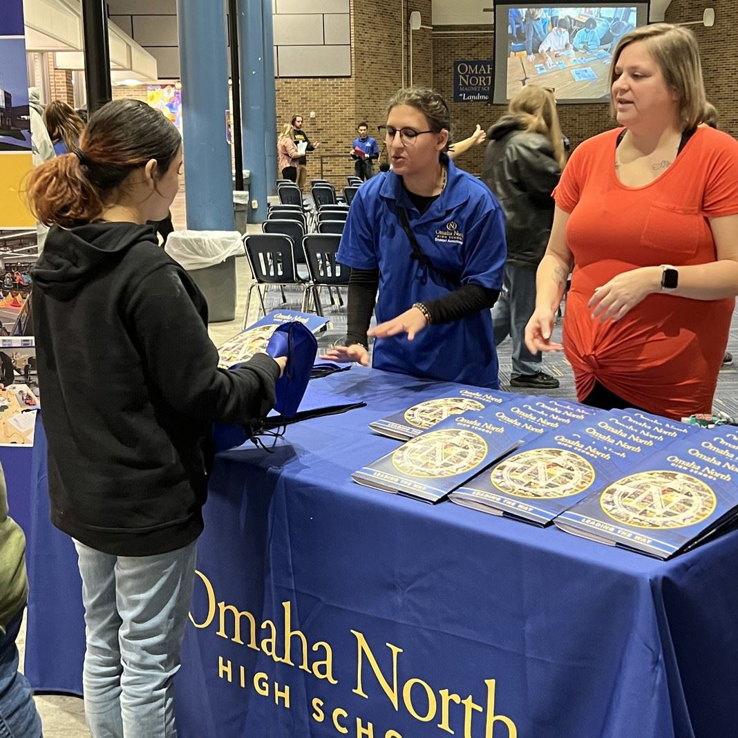  A student speaks with staff at Open House